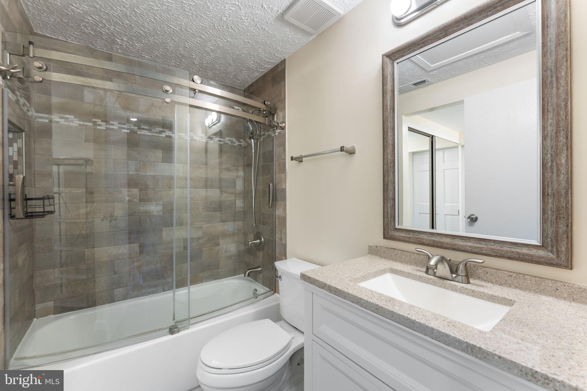 1644 Fieldthorn Drive Reston, VA 20194 - Photo 21 of 43 a bathroom with a granite countertop sink toilet and shower