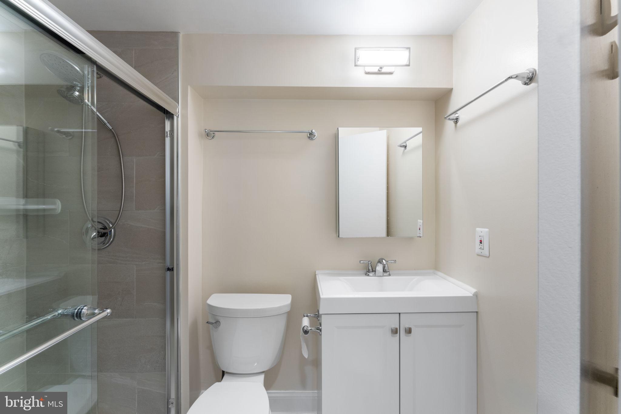 1644 Fieldthorn Drive Reston, VA 20194 - Photo 26 of 43 a bathroom with a sink a toilet and shower