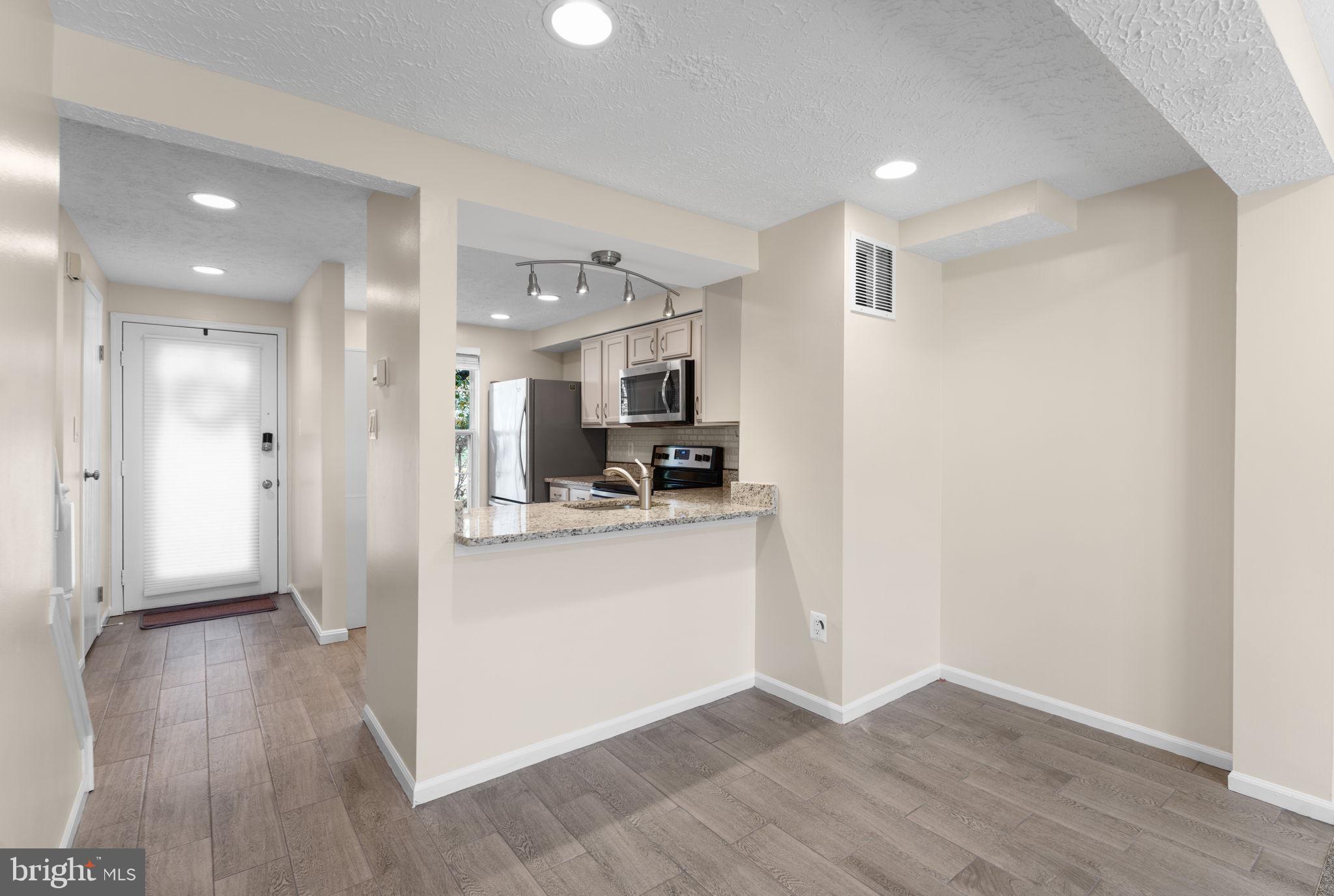 1644 Fieldthorn Drive Reston, VA 20194 - Photo 4 of 43 a view of kitchen with wooden floor