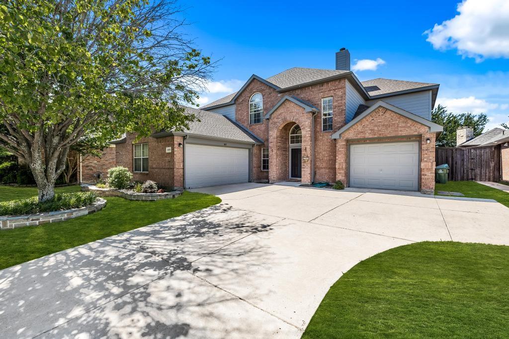 3805 Overlook Court The Colony, TX 75056 - Photo 1 of 1 a front view of a house with a garden and yard