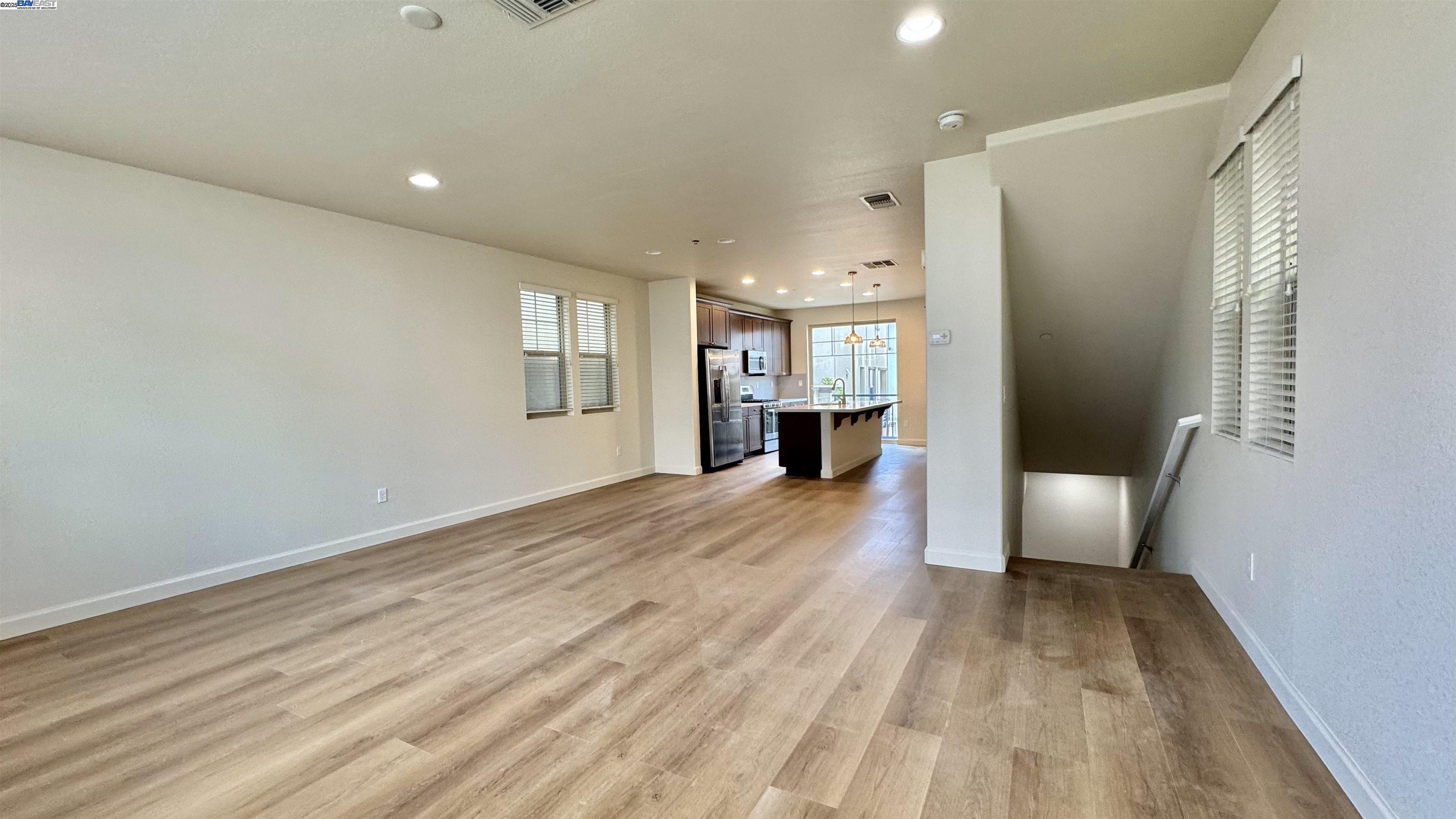 2906 Worthing Common Livermore, CA 94550 - Photo 11 of 31 a view of empty room with wooden floor