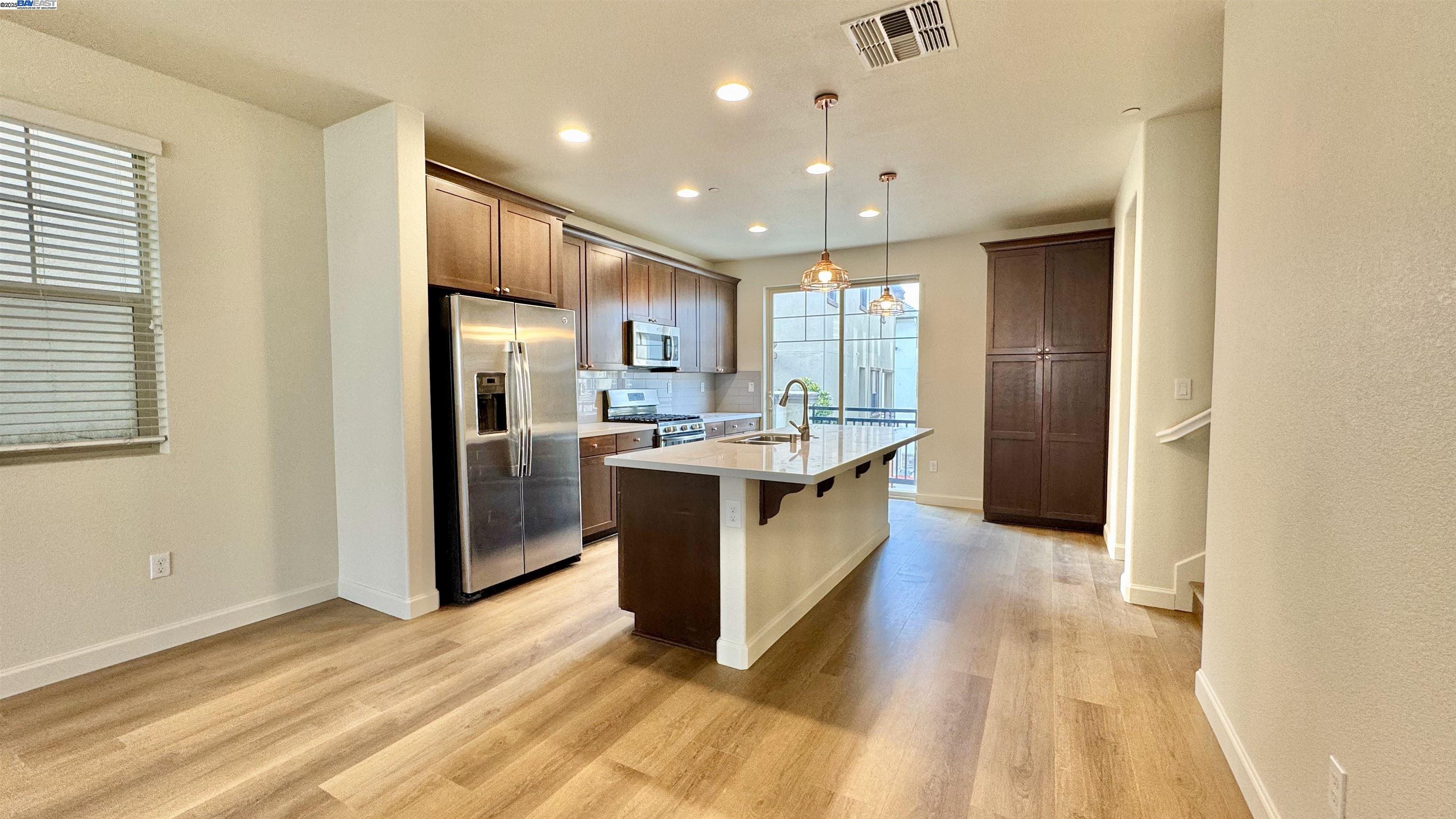 2906 Worthing Common Livermore, CA 94550 - Photo 13 of 31 a kitchen with stainless steel appliances granite countertop a refrigerator and a sink