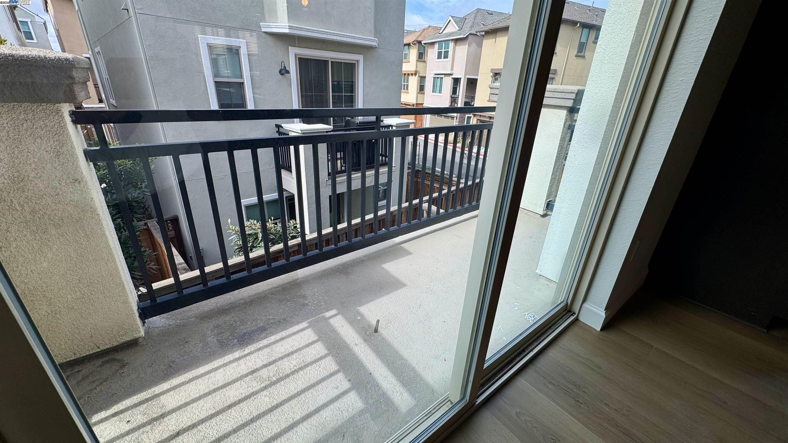 2906 Worthing Common Livermore, CA 94550 - Photo 17 of 31 a view of a hallway with wooden floor and stairs