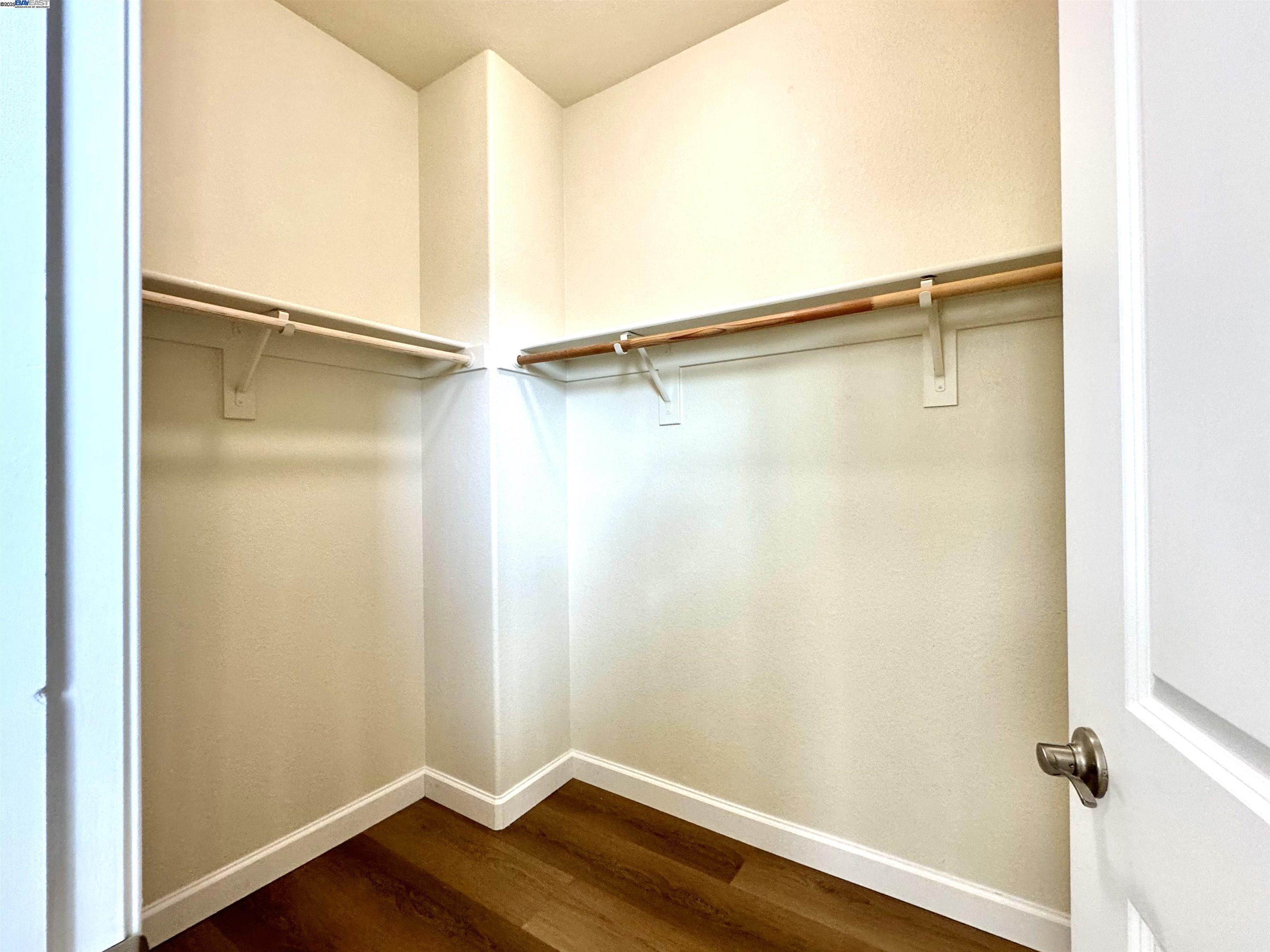 2906 Worthing Common Livermore, CA 94550 - Photo 23 of 31 a view of an empty walk in closet with wooden floor