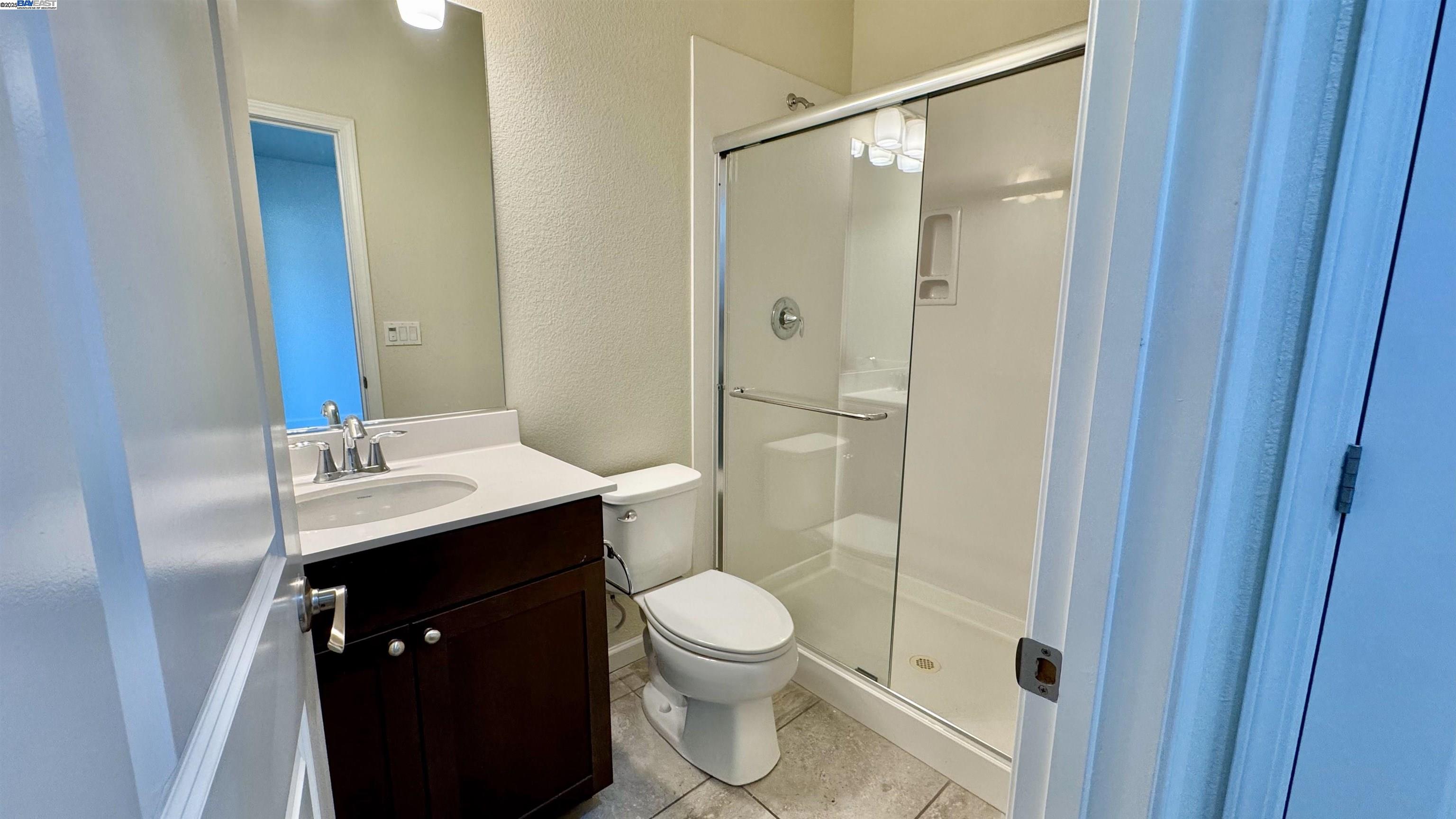2906 Worthing Common Livermore, CA 94550 - Photo 8 of 31 a bathroom with a sink a toilet and shower