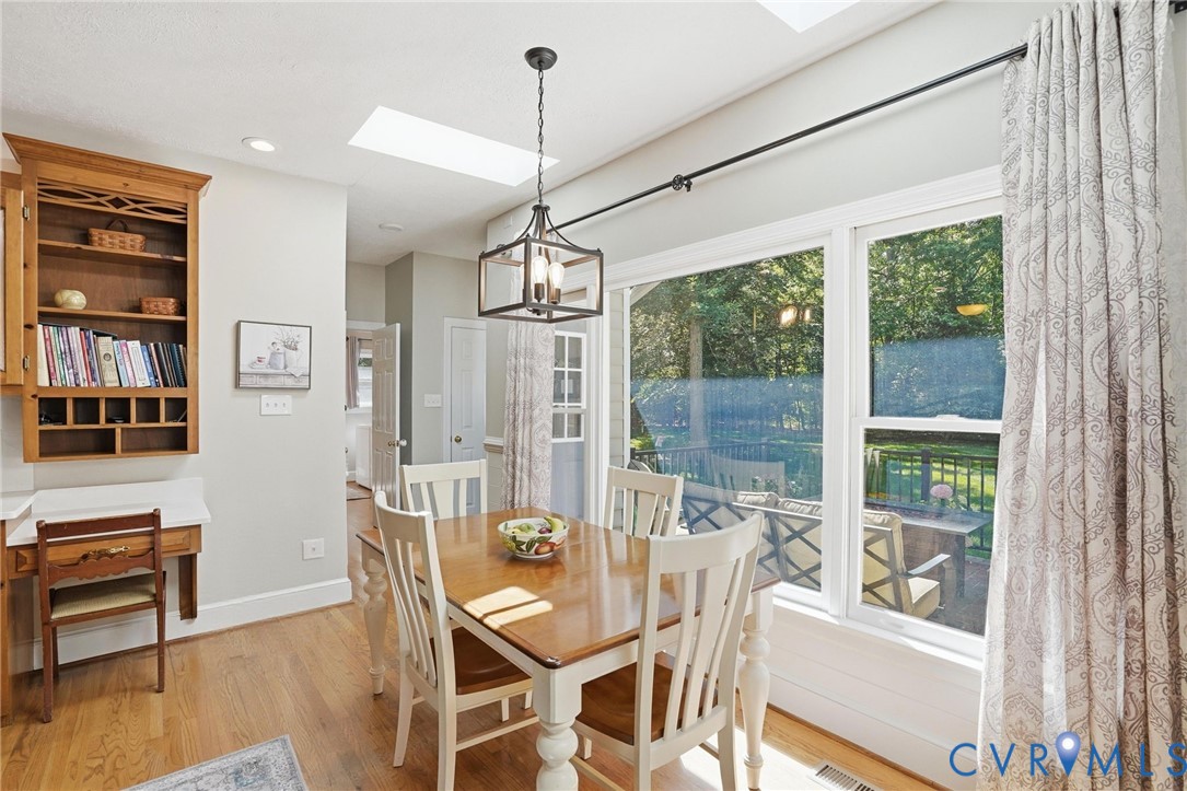 12123 Deer Ridge Court Ashland, VA 23005 - Photo 23 of 63 a view of a dining room with furniture window and wooden floor