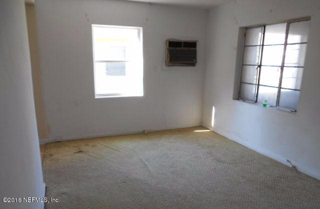 3635 Freeman Road Jacksonville, FL 32207 - Photo 5 of 13 an empty room with windows