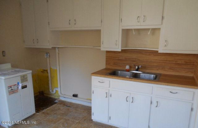 3635 Freeman Road Jacksonville, FL 32207 - Photo 7 of 13 a kitchen with a sink and cabinets