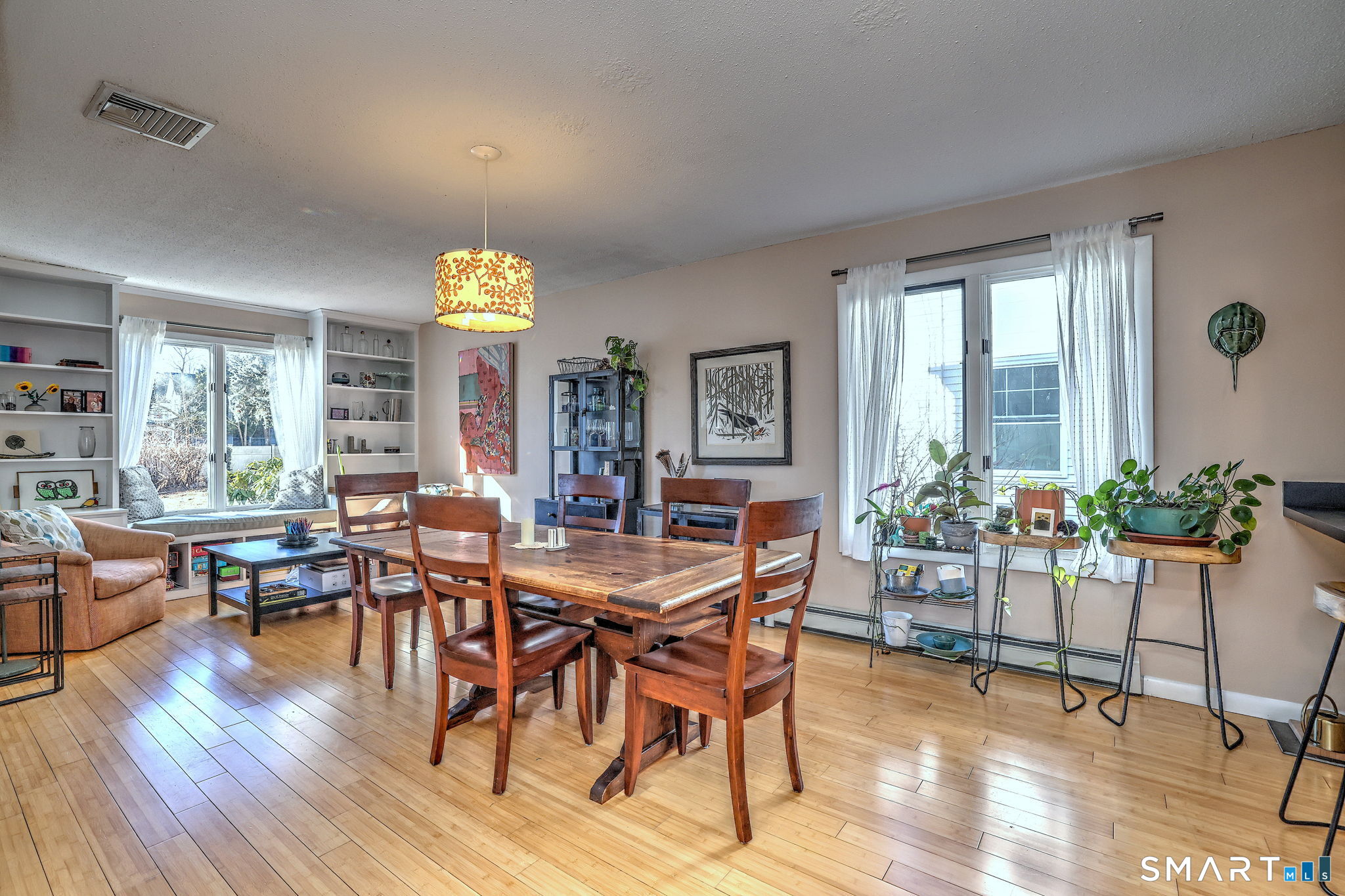 67 Hauser Street Milford, CT 06460 - Photo 11 of 40 a view of a dining room with furniture window and wooden floor