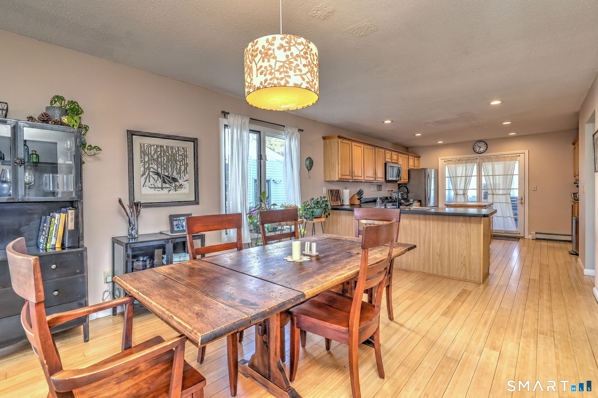 67 Hauser Street Milford, CT 06460 - Photo 13 of 40 a view of a dining room with furniture and a wooden floor