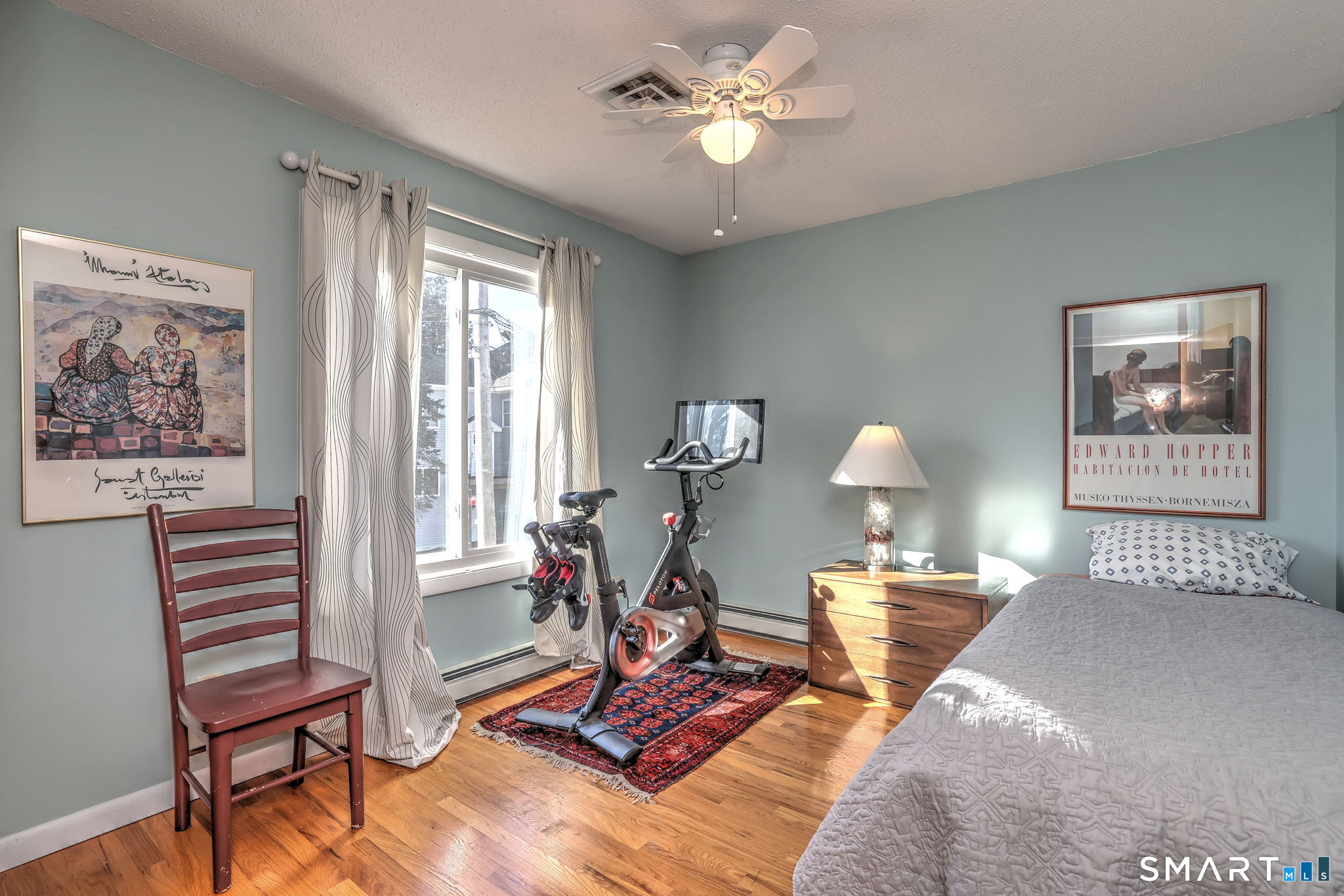 67 Hauser Street Milford, CT 06460 - Photo 27 of 40 a living room with furniture a window and a chandelier