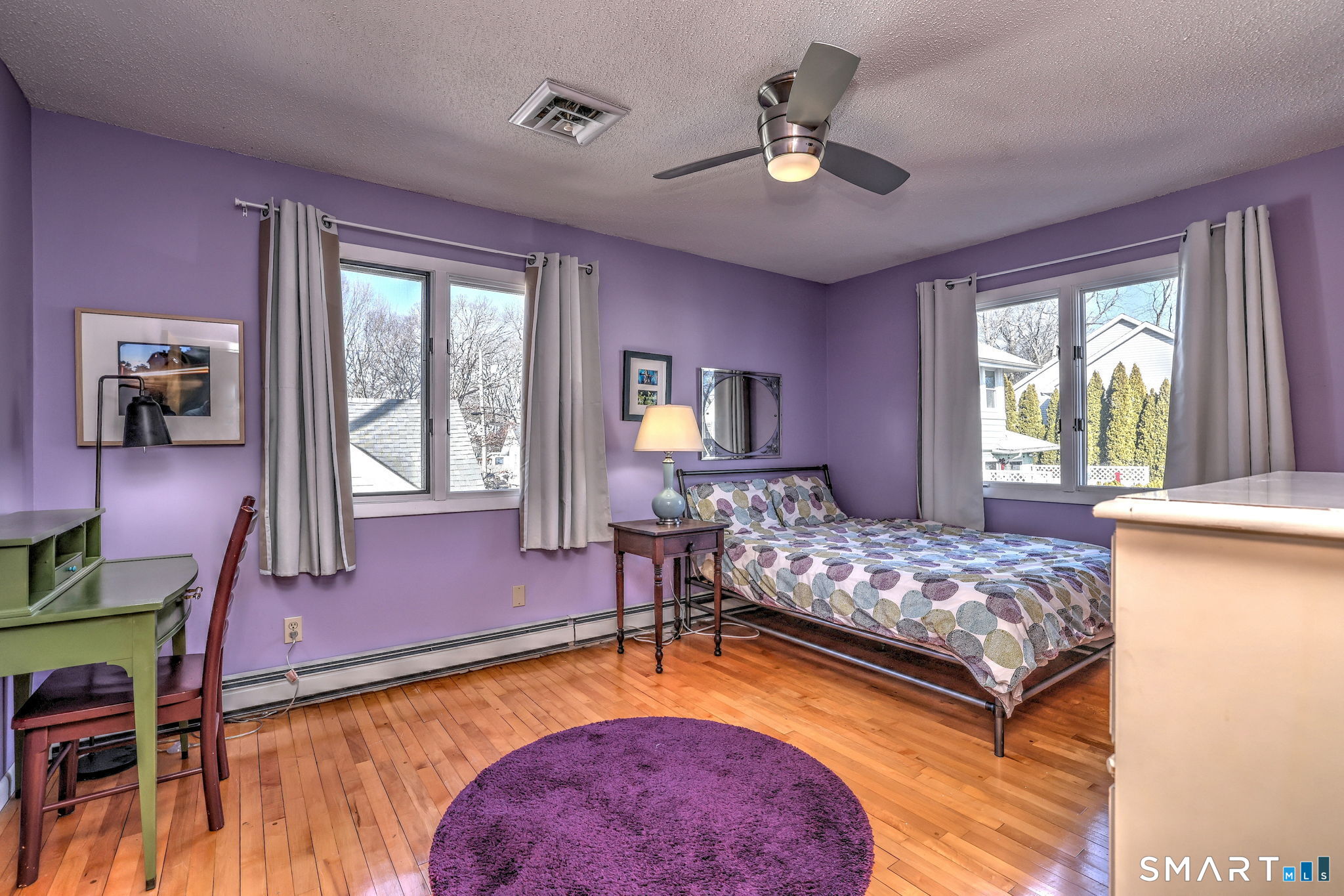 67 Hauser Street Milford, CT 06460 - Photo 29 of 40 a bedroom with a bed and a chandelier