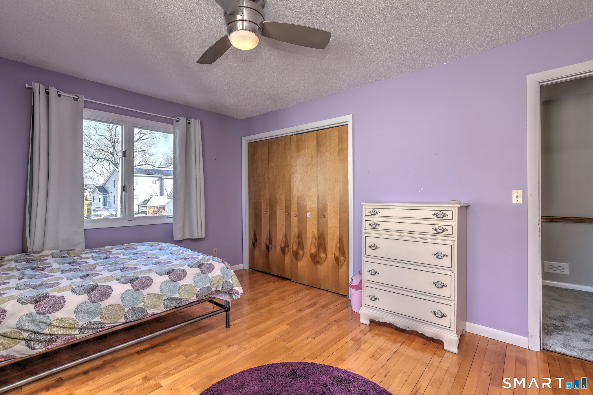 67 Hauser Street Milford, CT 06460 - Photo 30 of 40 a bedroom with a bed and a dresser