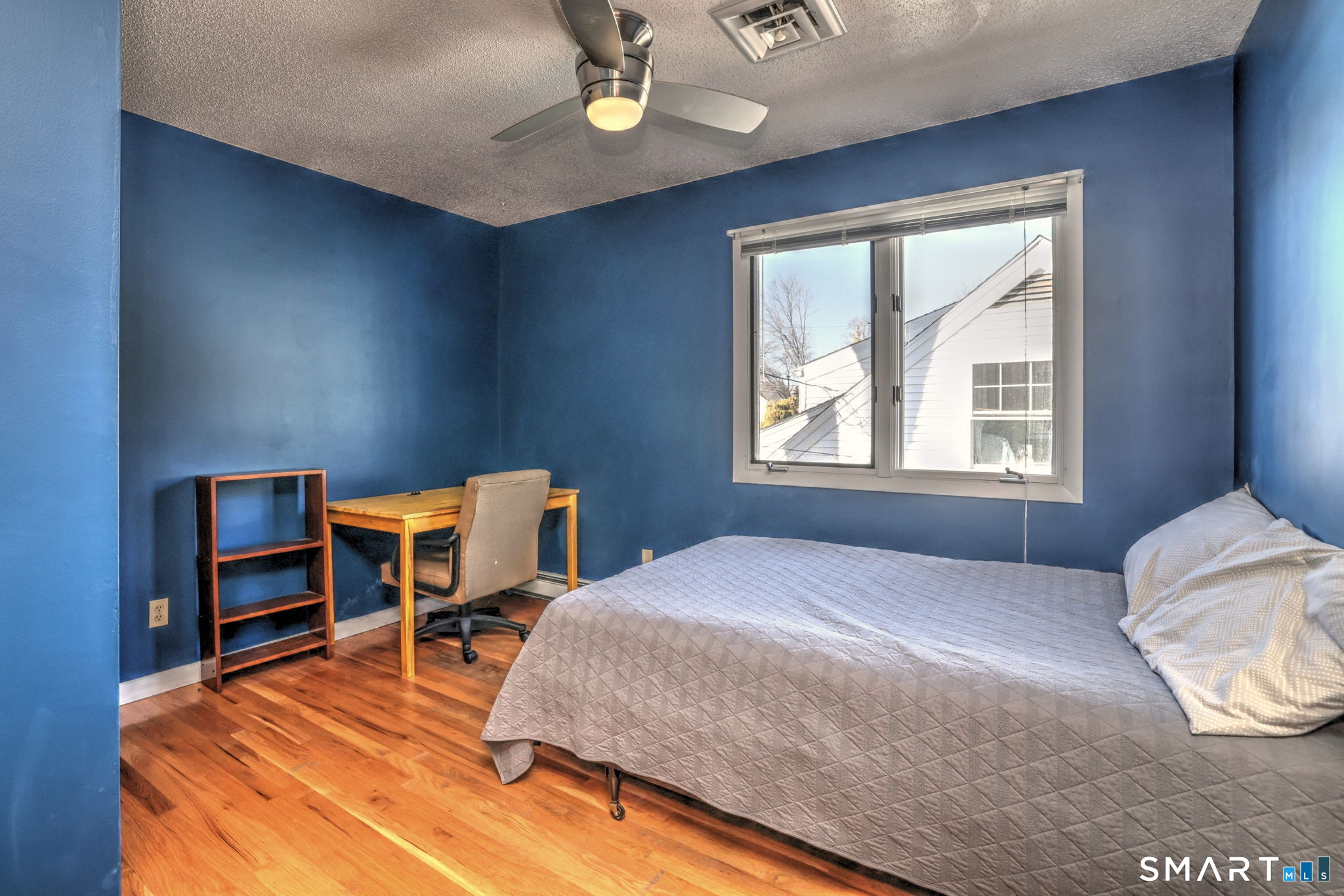 67 Hauser Street Milford, CT 06460 - Photo 31 of 40 a bedroom with a bed dresser and a window