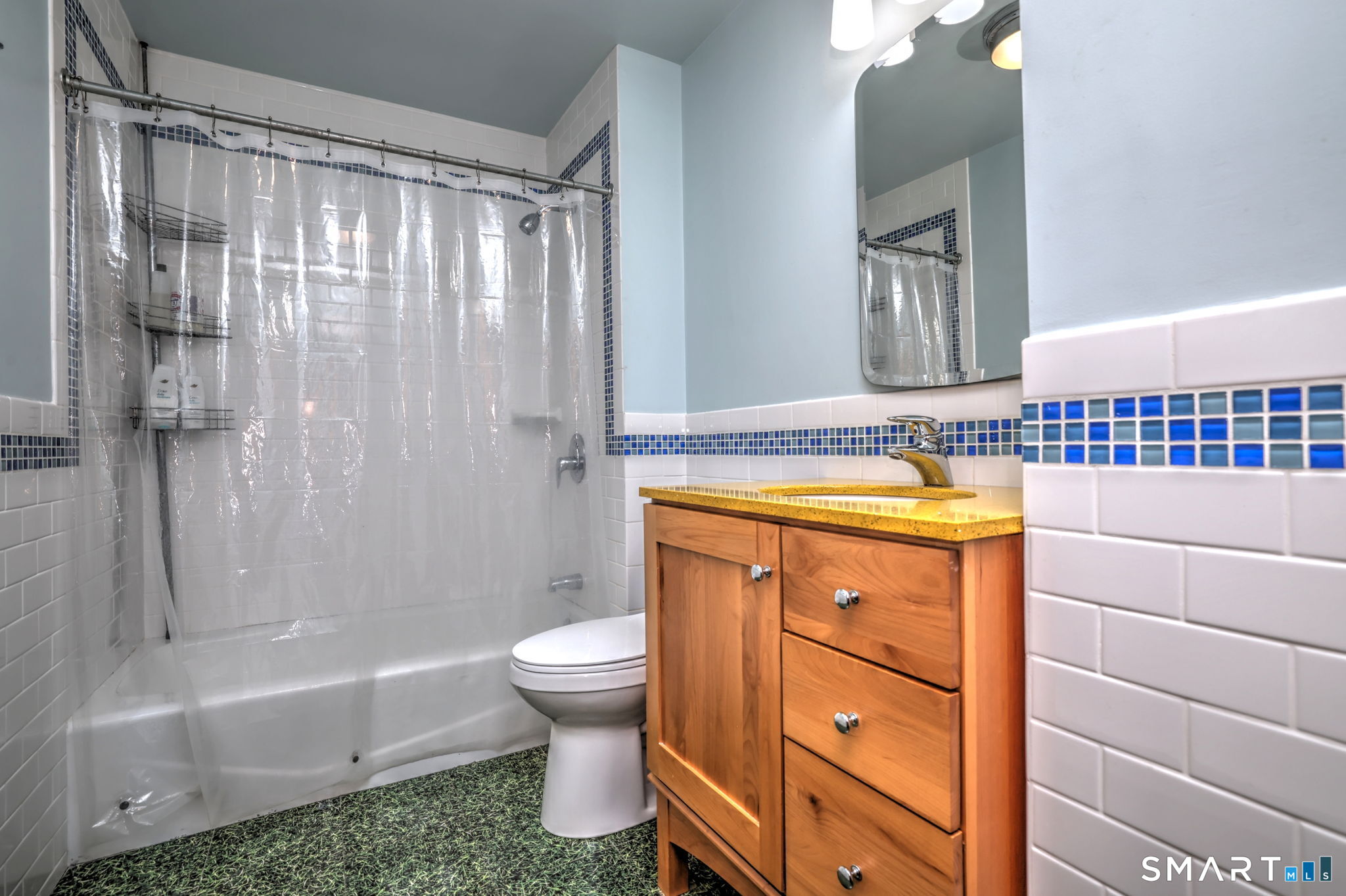 67 Hauser Street Milford, CT 06460 - Photo 33 of 40 a bathroom with a sink a toilet and shower