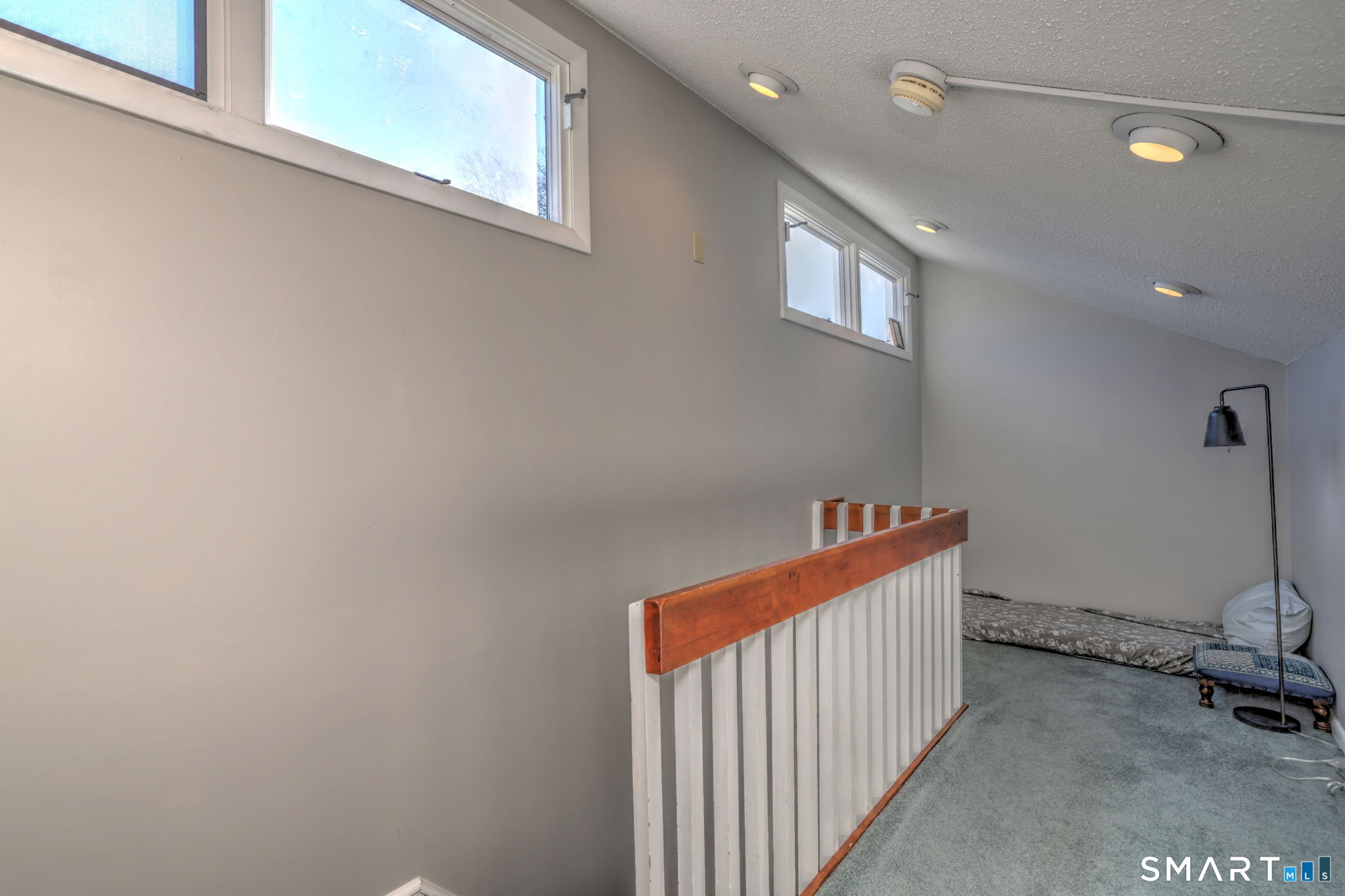 67 Hauser Street Milford, CT 06460 - Photo 35 of 40 a view of a hallway with windows