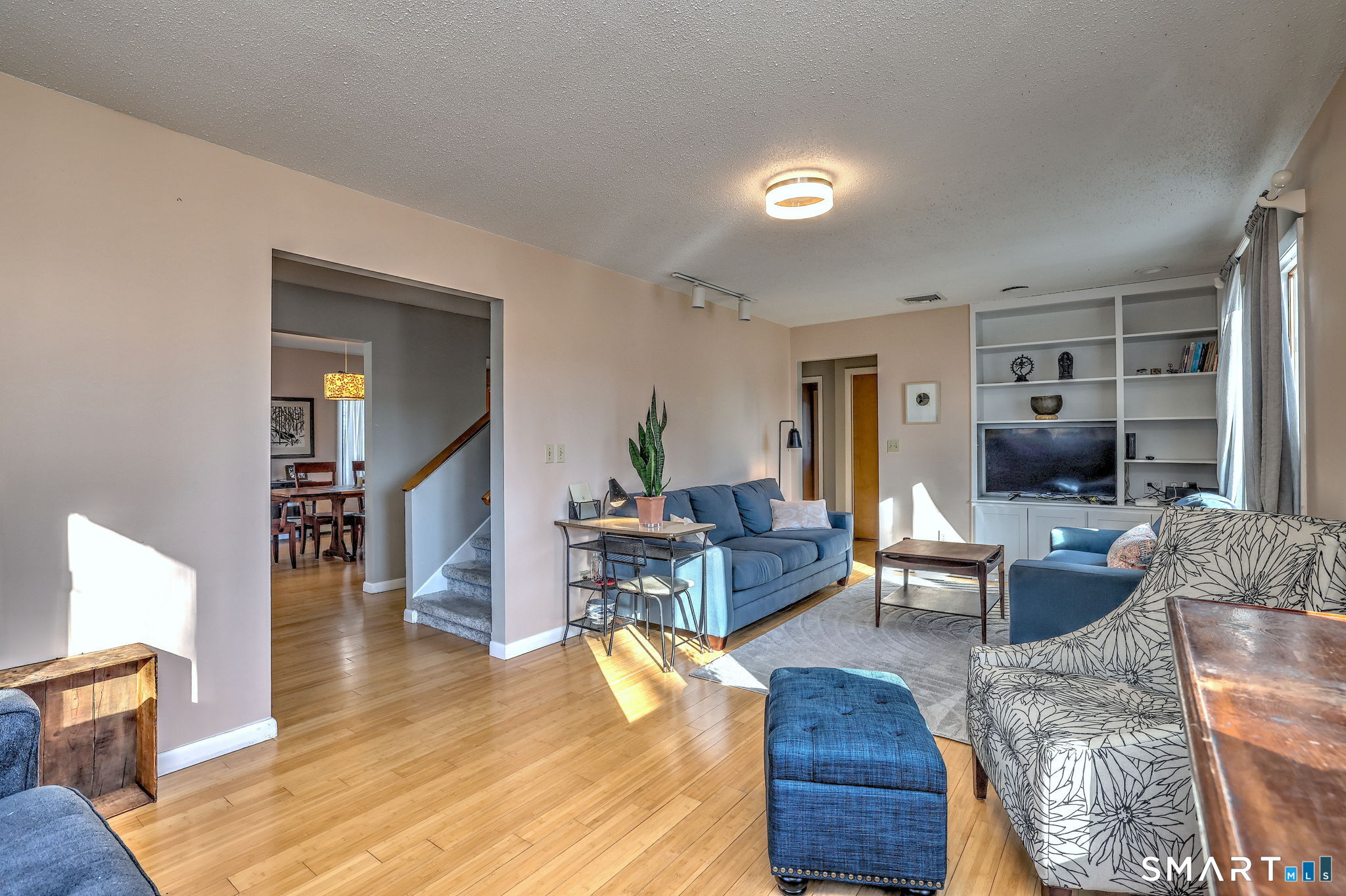 67 Hauser Street Milford, CT 06460 - Photo 5 of 40 a living room with furniture and a wooden floor