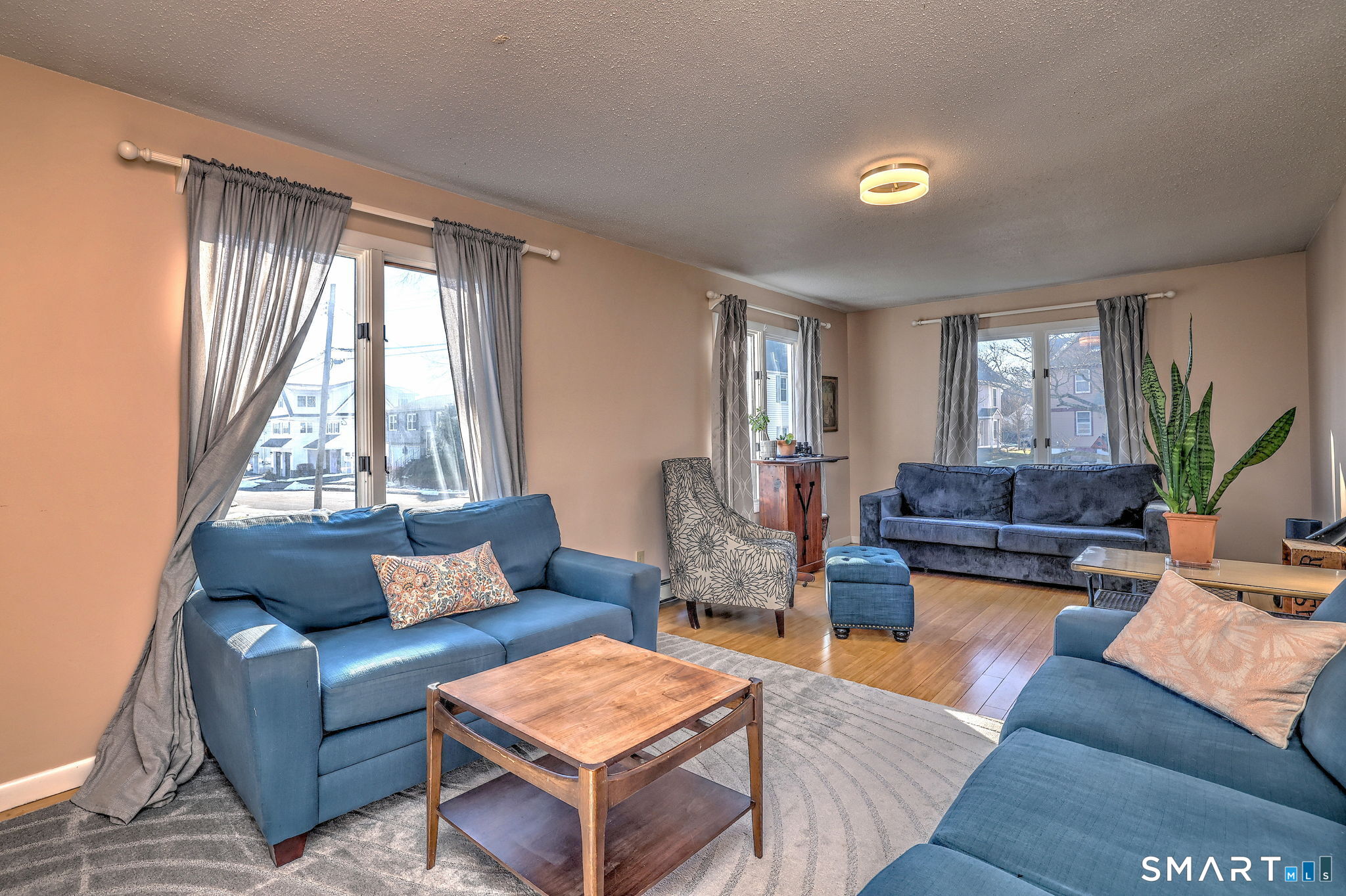 67 Hauser Street Milford, CT 06460 - Photo 6 of 40 a living room with furniture and a large window