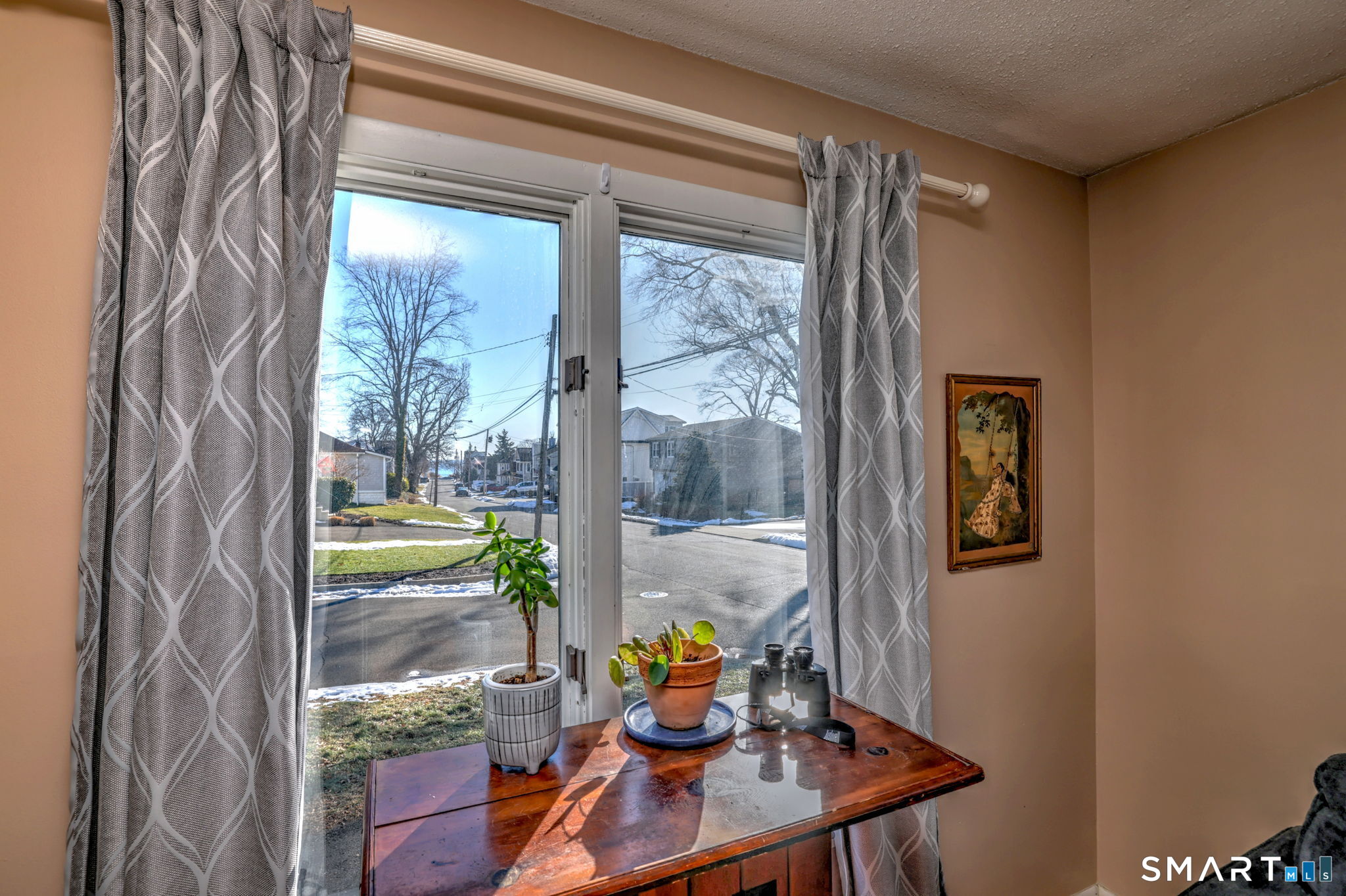 67 Hauser Street Milford, CT 06460 - Photo 7 of 40 a view of living room with furniture and floor to ceiling window