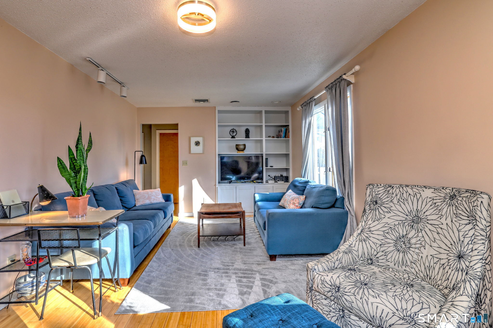 67 Hauser Street Milford, CT 06460 - Photo 8 of 40 a living room with furniture and a potted plant