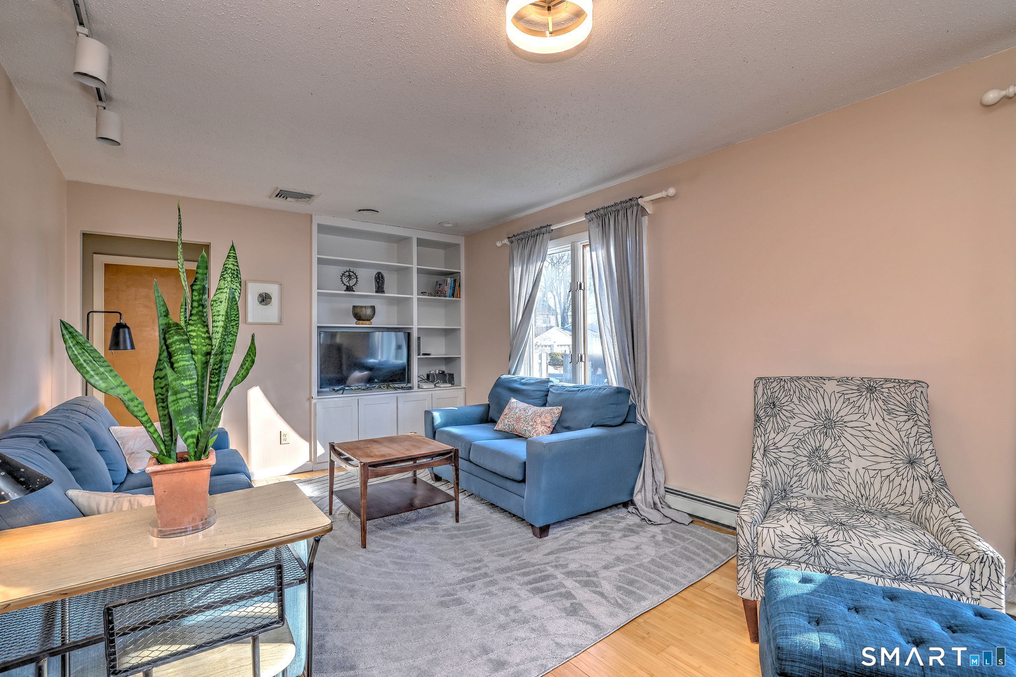 67 Hauser Street Milford, CT 06460 - Photo 9 of 40 a living room with furniture and a window