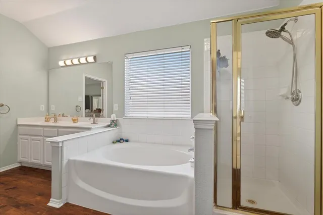 a bathroom with a bathtub and a sink