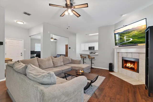 a living room with furniture and a fireplace