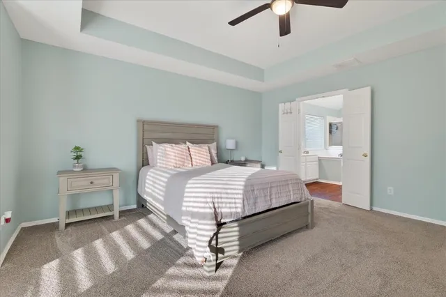 a bedroom with a bed and a lamp