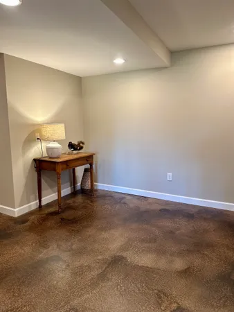 a room with a table and chairs