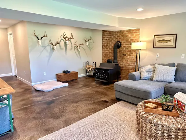 a bedroom with furniture and a large mirror