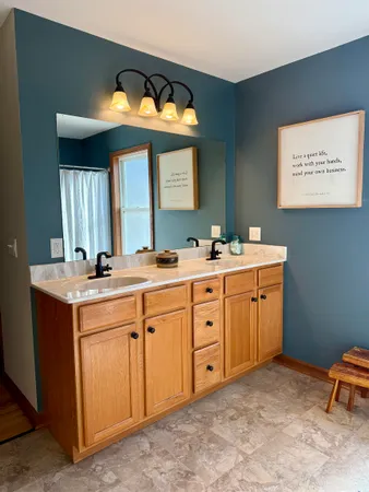 a bathroom with a sink and a mirror