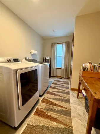 a view of a kitchen with washer and dryer
