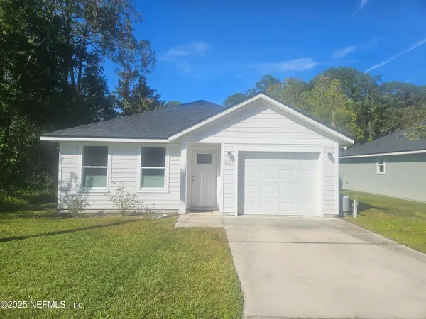 front view of a house with a yard