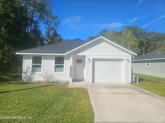 front view of a house with a yard