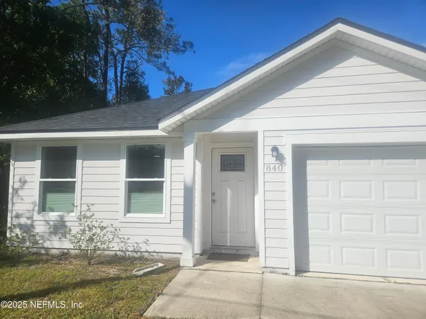 a kitchen with kitchen island a sink appliances and cabinets