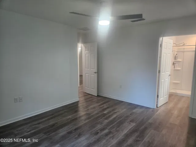 a bathroom with a shower and toilet