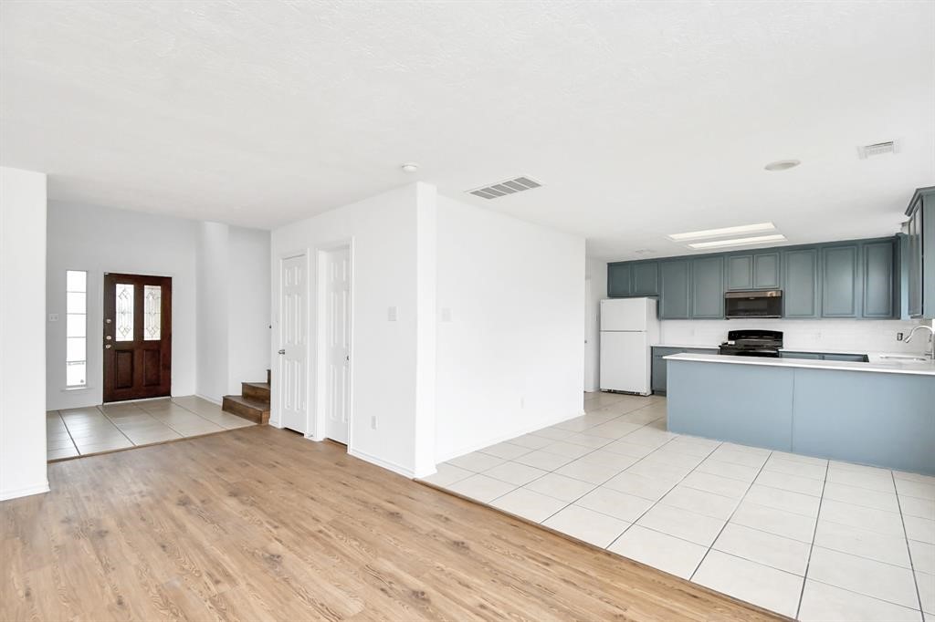 21818 Dimmett Way Spring, TX 77388 - Photo 11 of 35 a view of kitchen with refrigerator and window