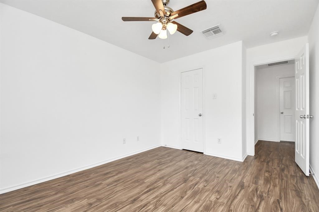 21818 Dimmett Way Spring, TX 77388 - Photo 17 of 35 a view of empty room with wooden floor