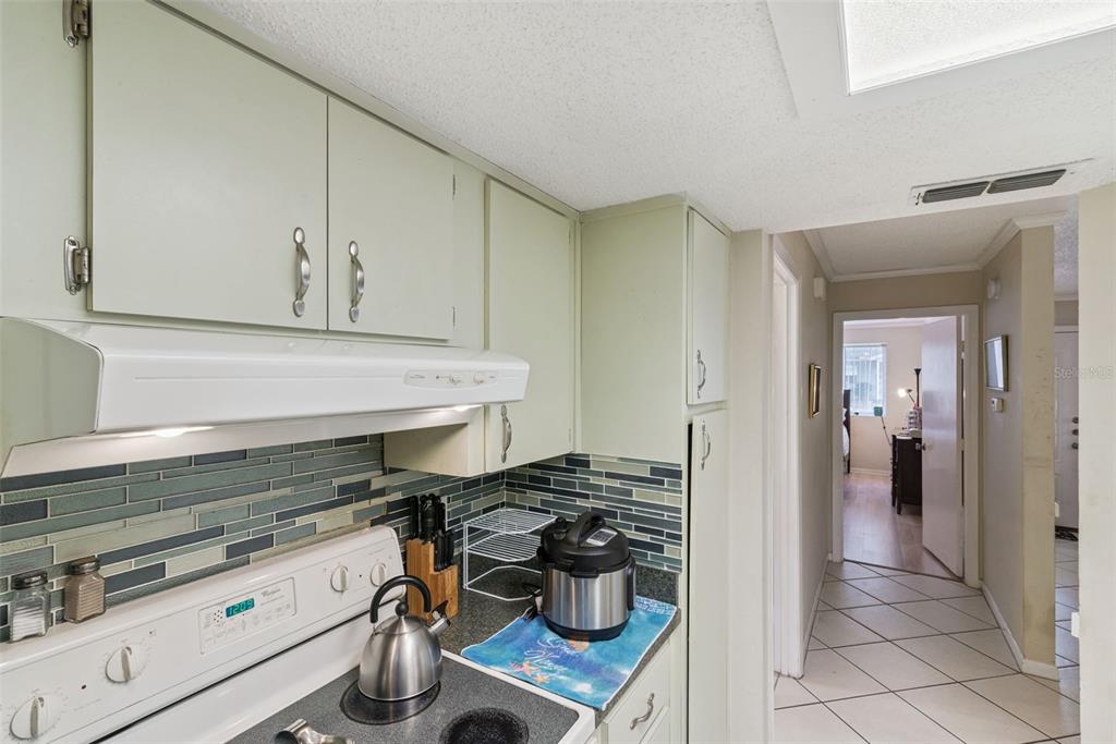 10943 Southwest 86th Court Ocala, FL 34481 - Photo 16 of 35 a kitchen with a stove and a refrigerator