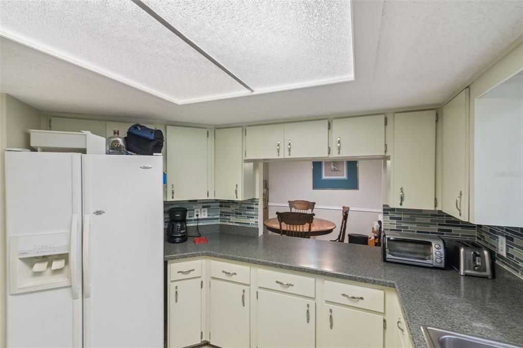 10943 Southwest 86th Court Ocala, FL 34481 - Photo 18 of 35 a kitchen with stainless steel appliances a refrigerator and a stove