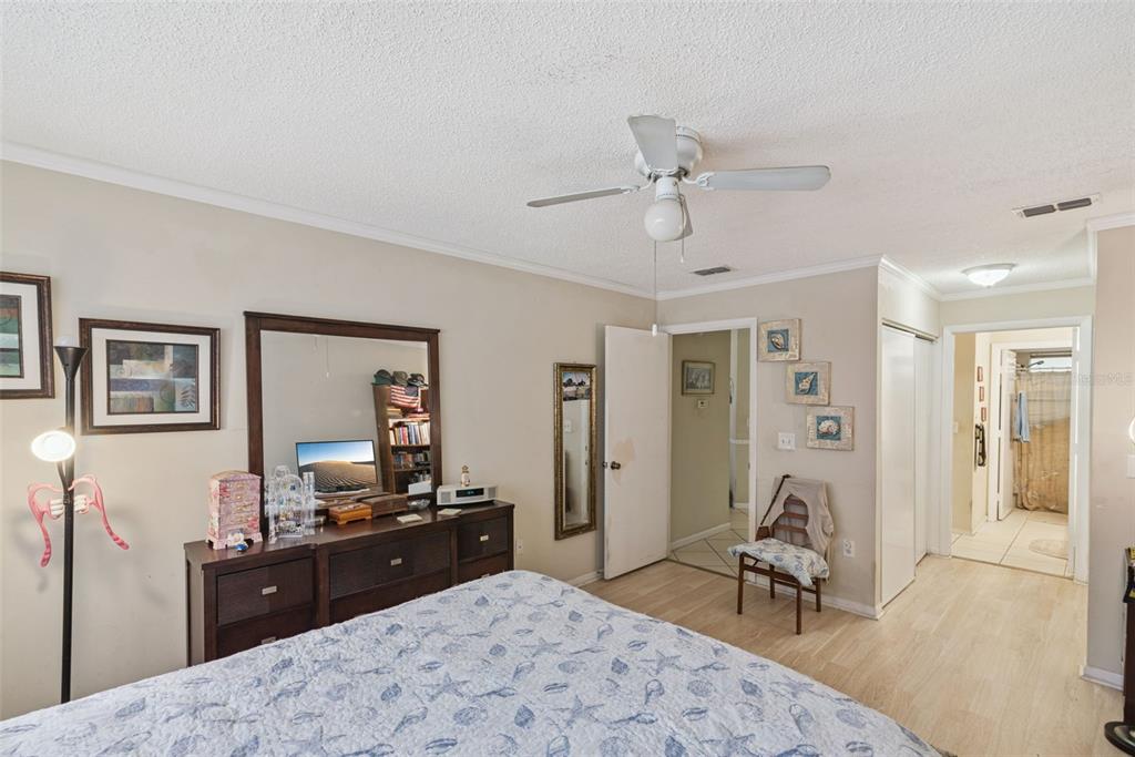 10943 Southwest 86th Court Ocala, FL 34481 - Photo 22 of 35 a bed room with a bed and a television