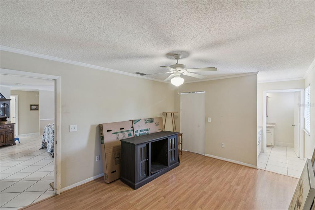 10943 Southwest 86th Court Ocala, FL 34481 - Photo 27 of 35 a view of a kitchen with a sink cabinets and wooden floor