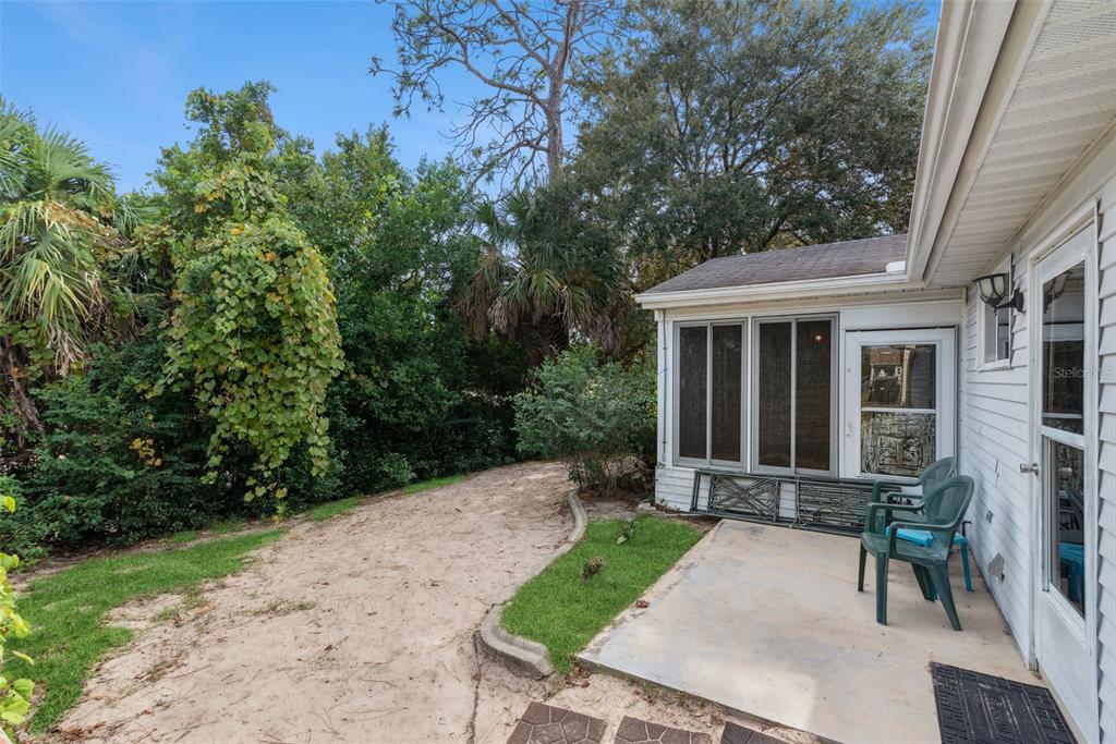 10943 Southwest 86th Court Ocala, FL 34481 - Photo 33 of 35 a view of a house with backyard and sitting area