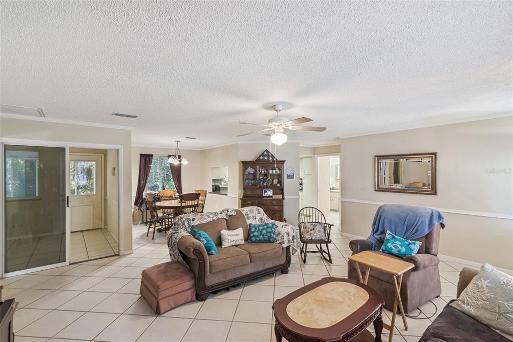 10943 Southwest 86th Court Ocala, FL 34481 - Photo 10 of 35 a living room with furniture and a wooden floor