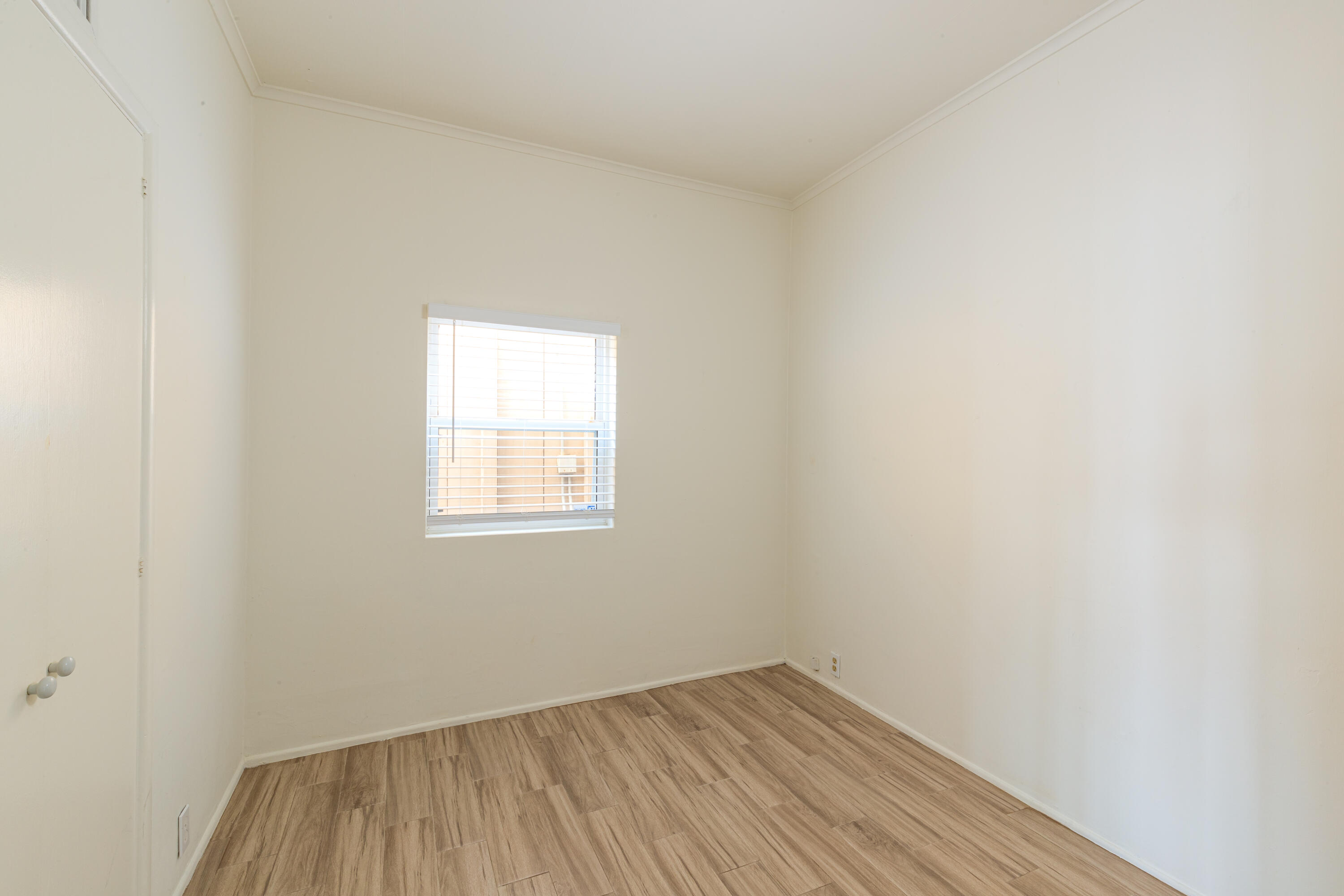 1520 Miramar Beach Montecito, CA 93108 - Photo 12 of 18 a view of an empty room with wooden floor and a window