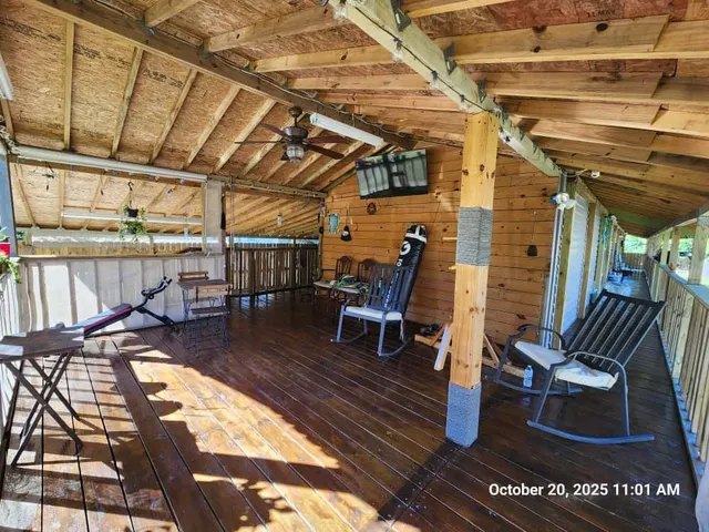 a view of a chairs and table in the patio
