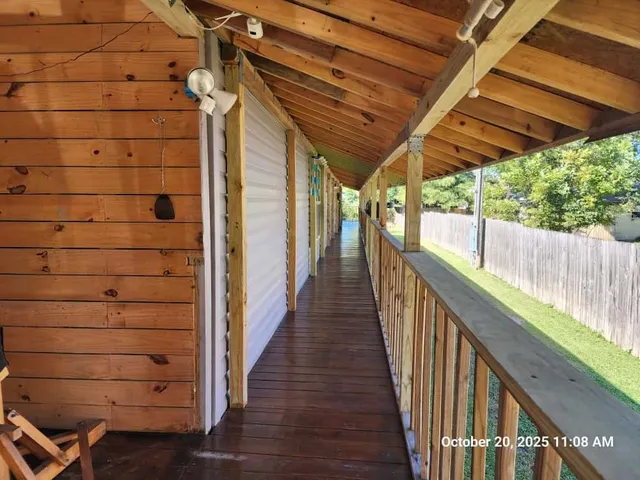 a view of a balcony with wooden floor