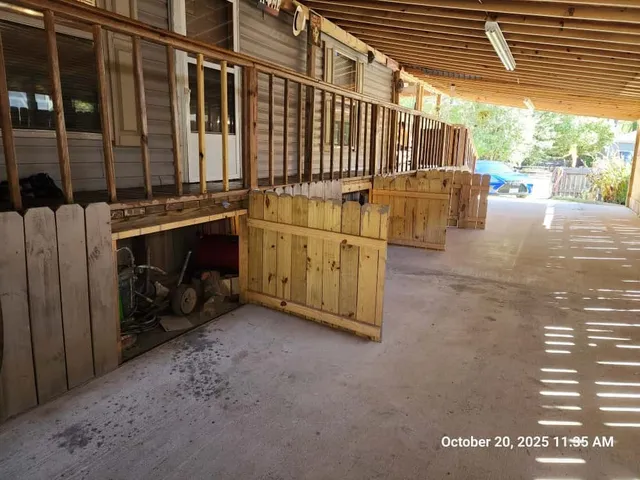a view of a porch with wooden floor