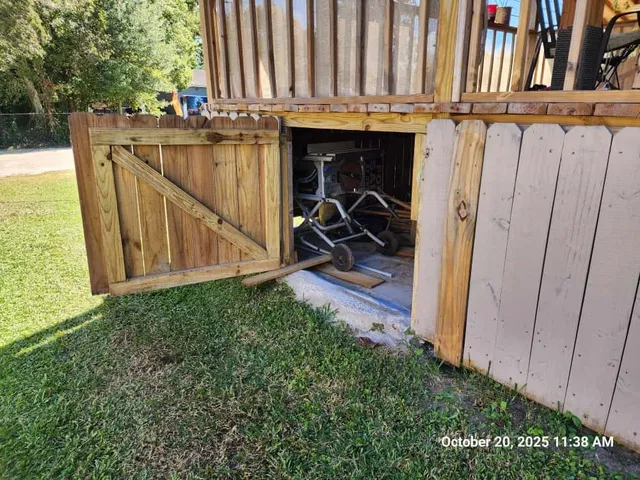 a view of a backyard with sitting area and tub
