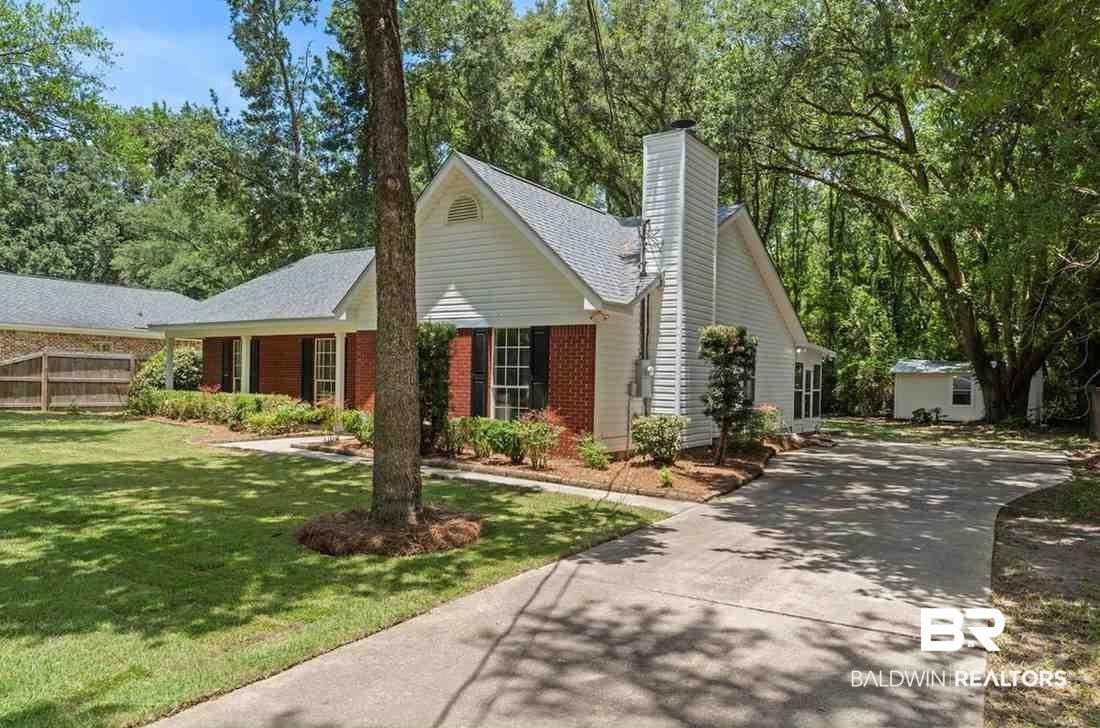 10251 Windmill Road Fairhope, AL 36532 - Photo 6 of 44 Single story home featuring driveway, a chimney, brick siding, and a shingled roof